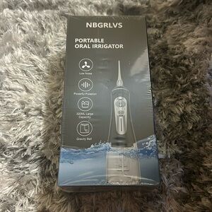 NWT portable oral irrigator or water flosser